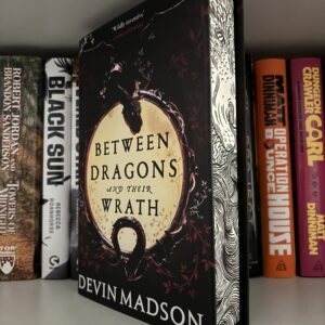 Signed Between Dragons and Their Wrath by Devin Madison - Broken Binding